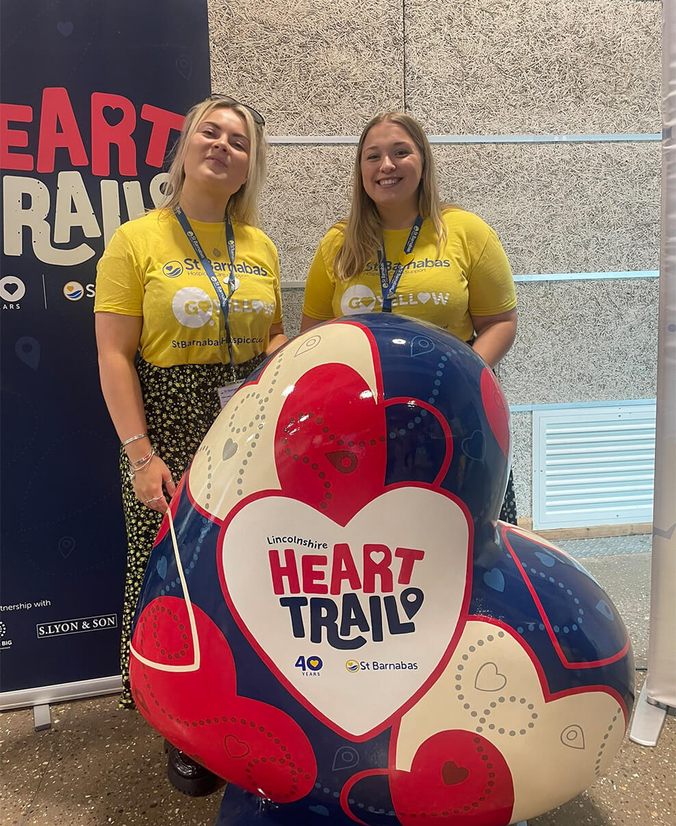 St Barnabas staff with one of the hearts from the trail